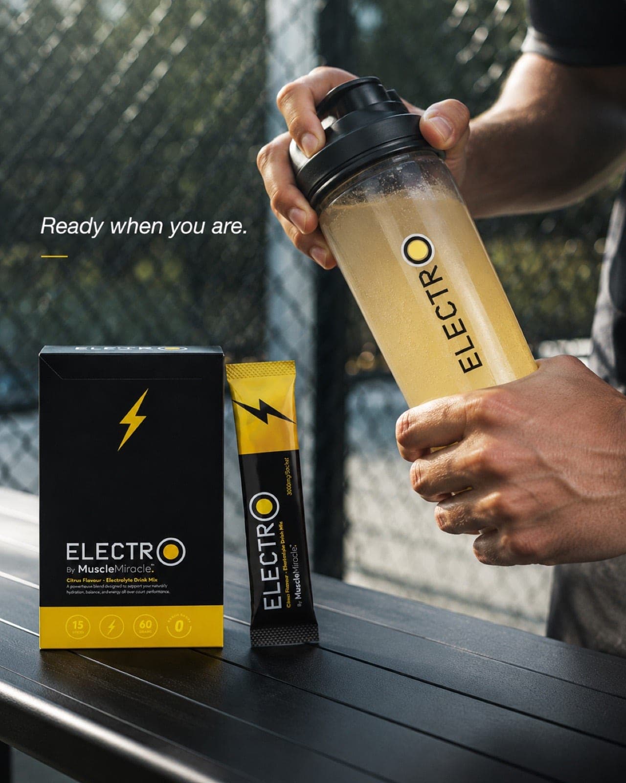 Shaking up a Muscle Miracle Electrolytes Citrus drink in a bottle after a session
