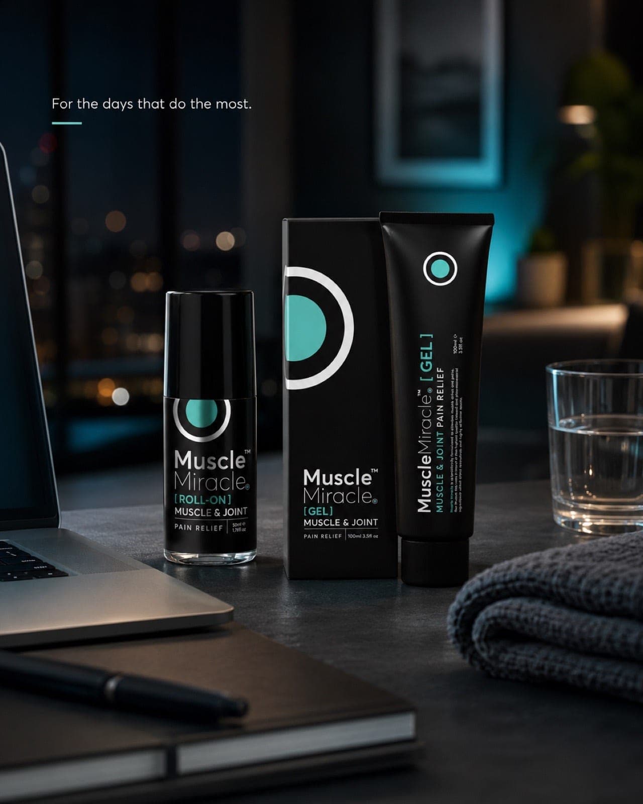 Muscle Miracle gel and roll-on on a desk by a window at night, city lights behind