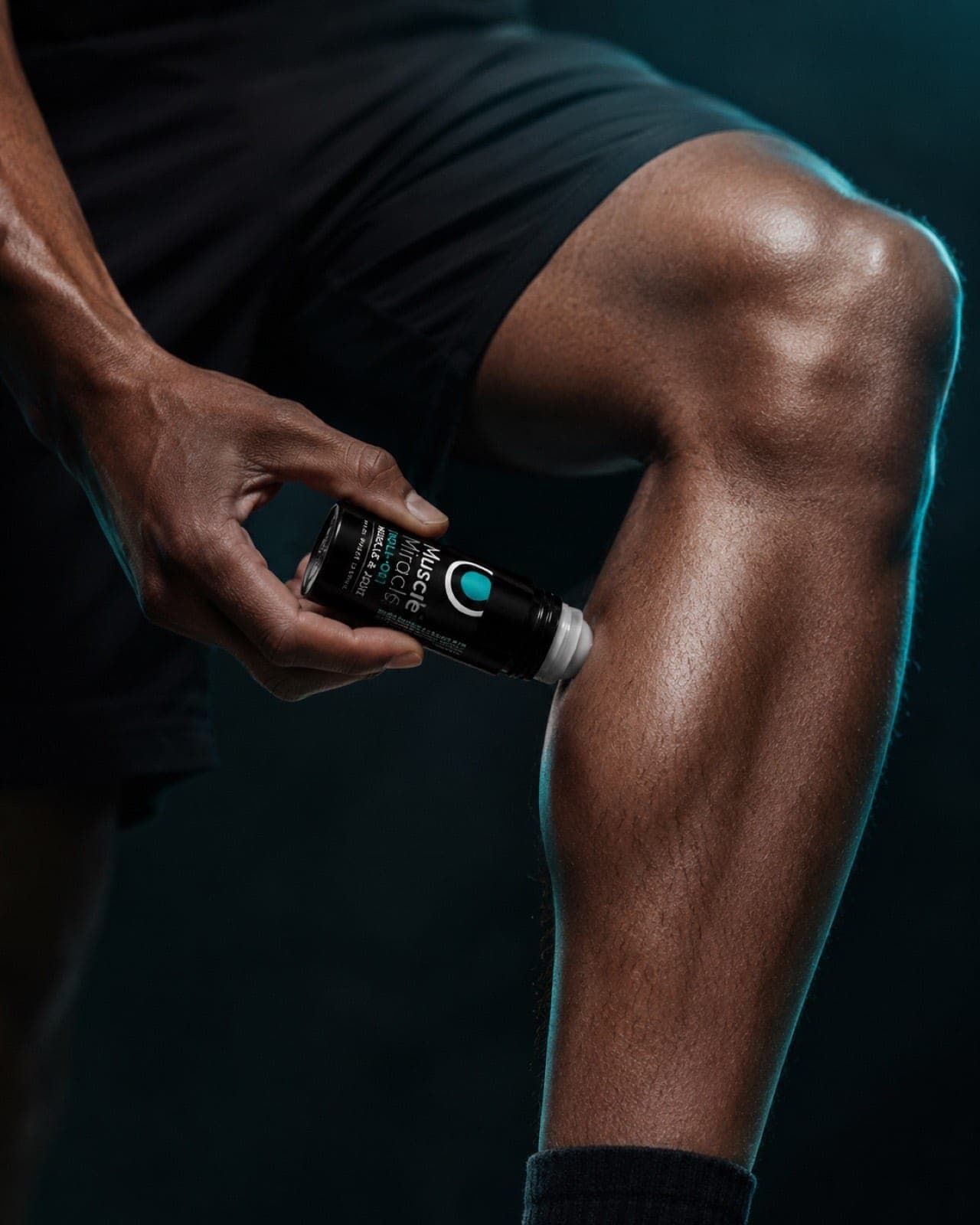 Gliding the Muscle Miracle cooling roll-on over the leg as the first step of a wind-down