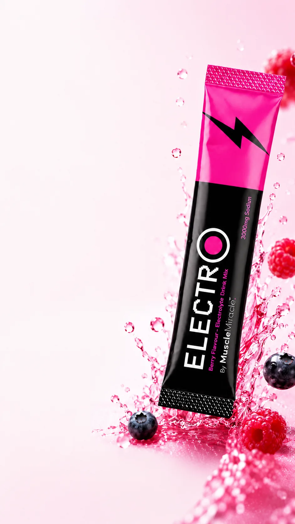 Electrolytes Berry stick in a pink electrolyte splash with raspberries and blueberries